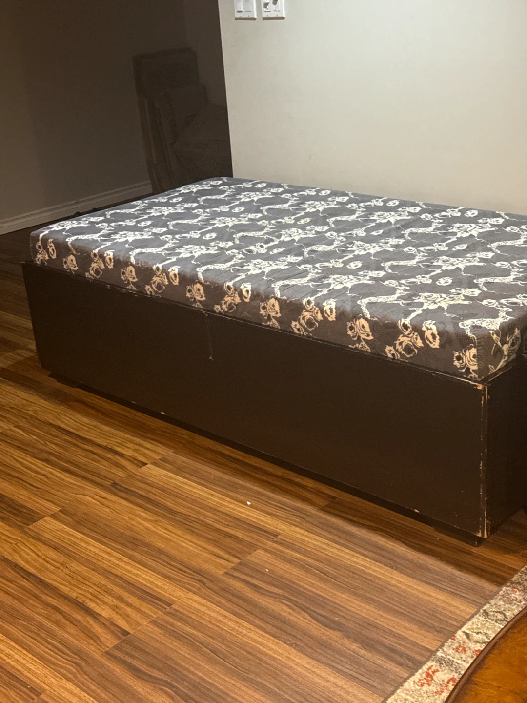 Single storage bed base with floral mattress