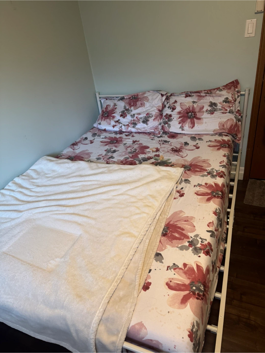 White metal bed frame and memory foam mattress
