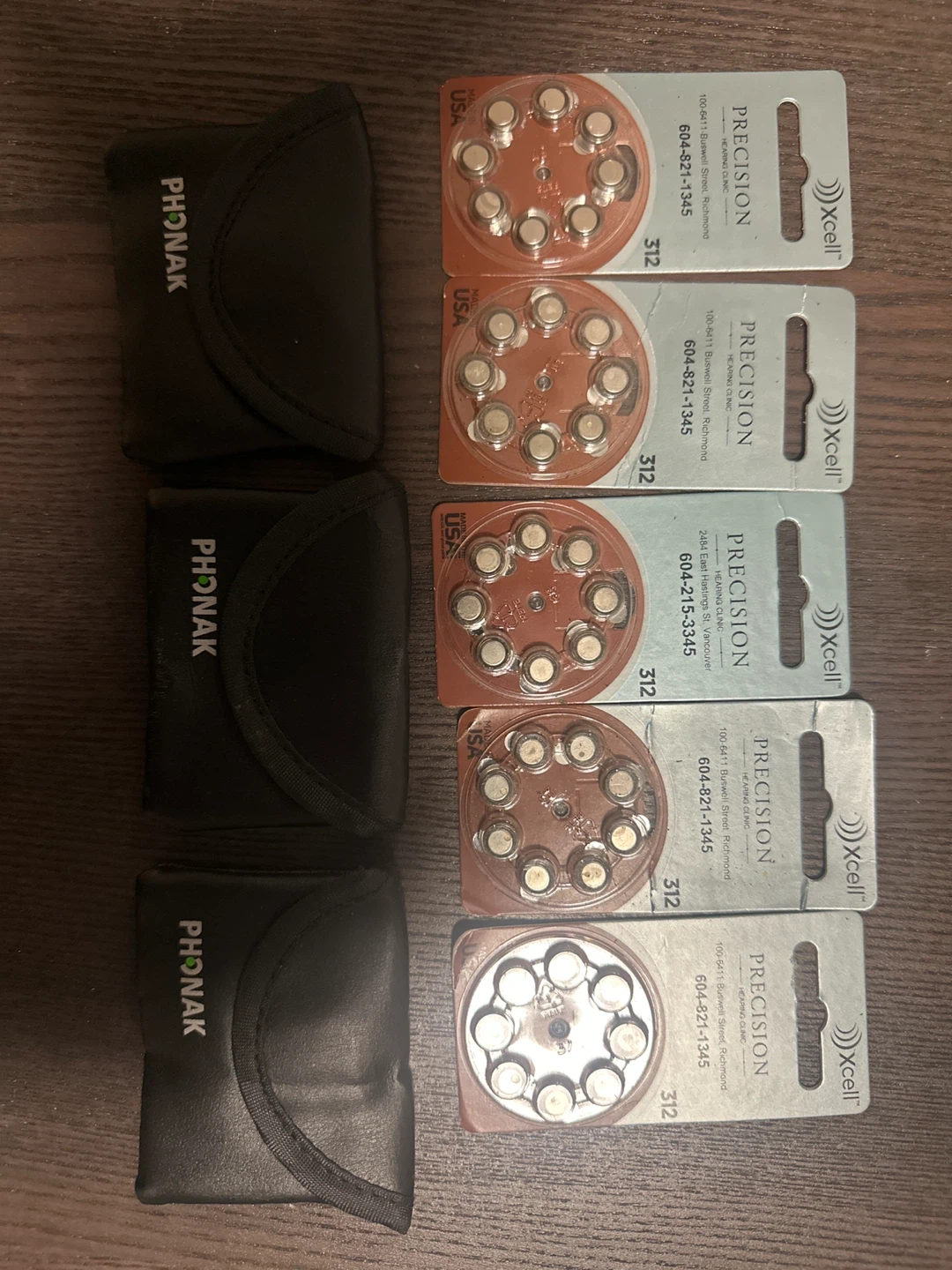 Phonak pouches and Xcell 312 hearing aid batteries