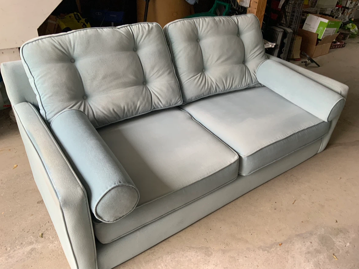 Light blue two-seater sofa