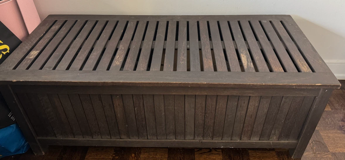 Dark brown wooden storage bench