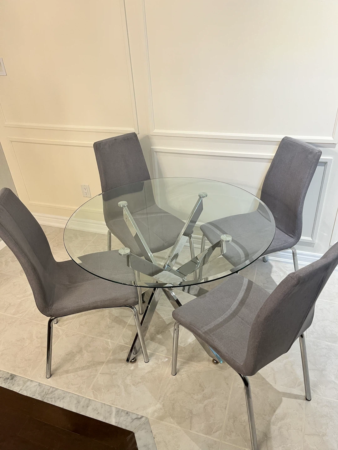 Round Glass Dining Table with 4 Grey Chairs