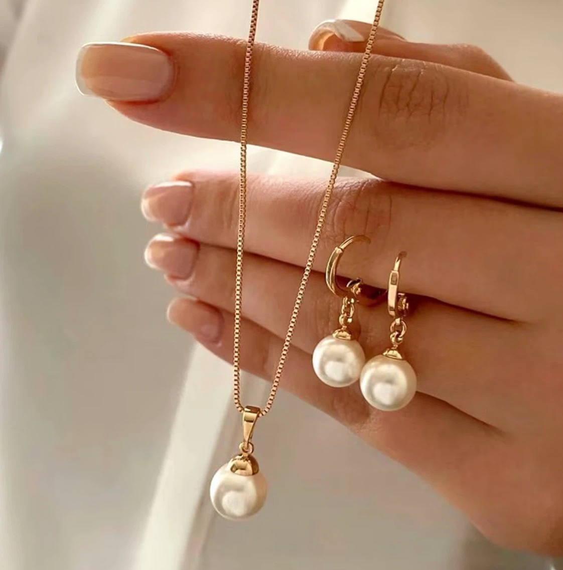 Gold-toned pearl necklace and earrings set
