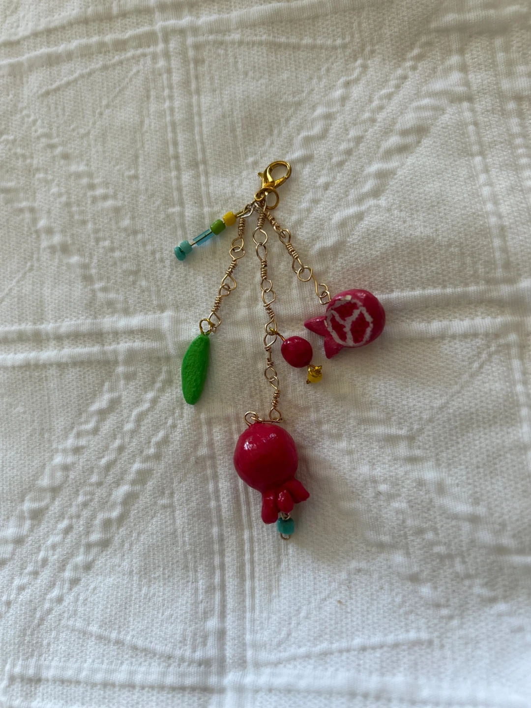 Handmade clay pomegranate charm
