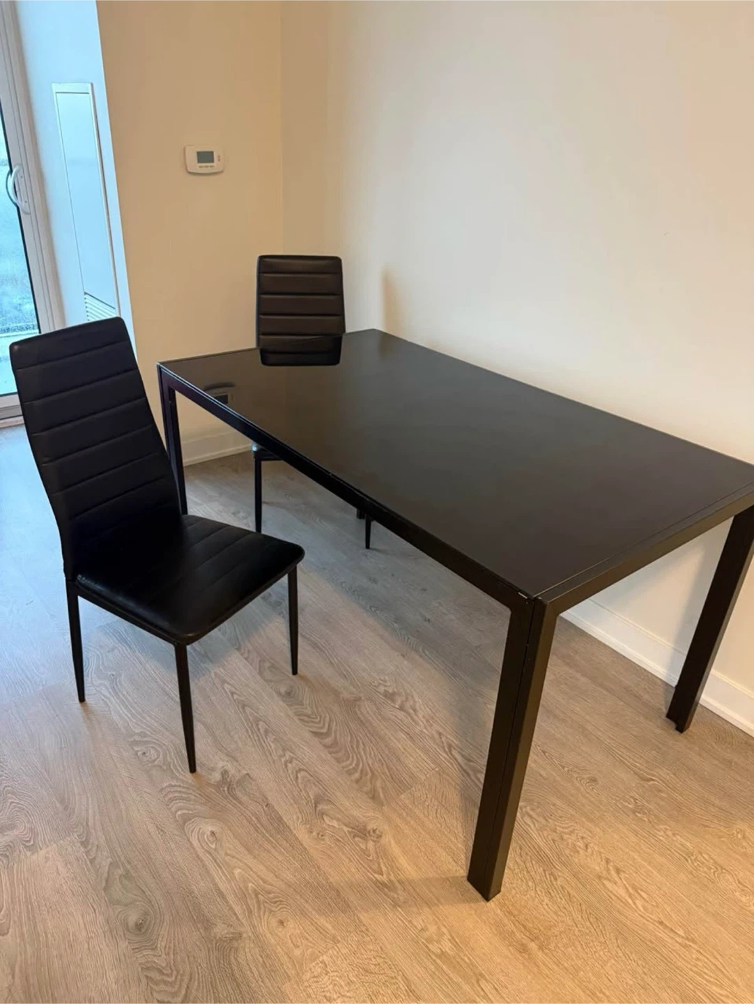 Black glass dining table with 6 chairs
