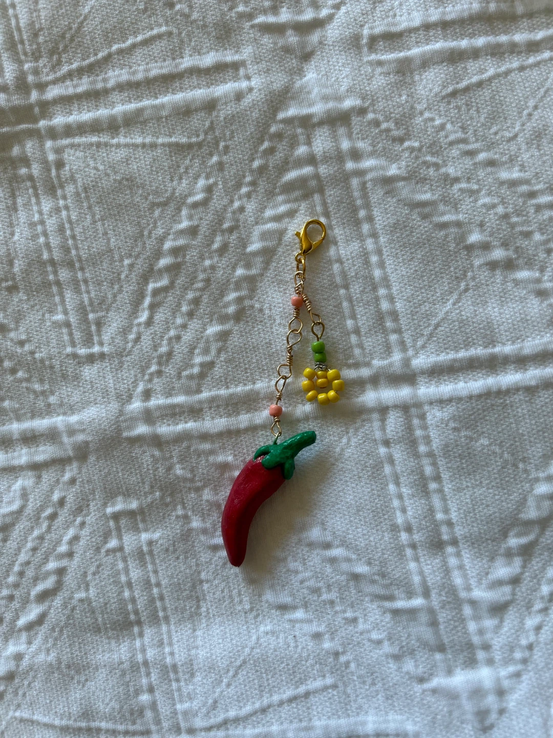 Chili pepper and flower charm