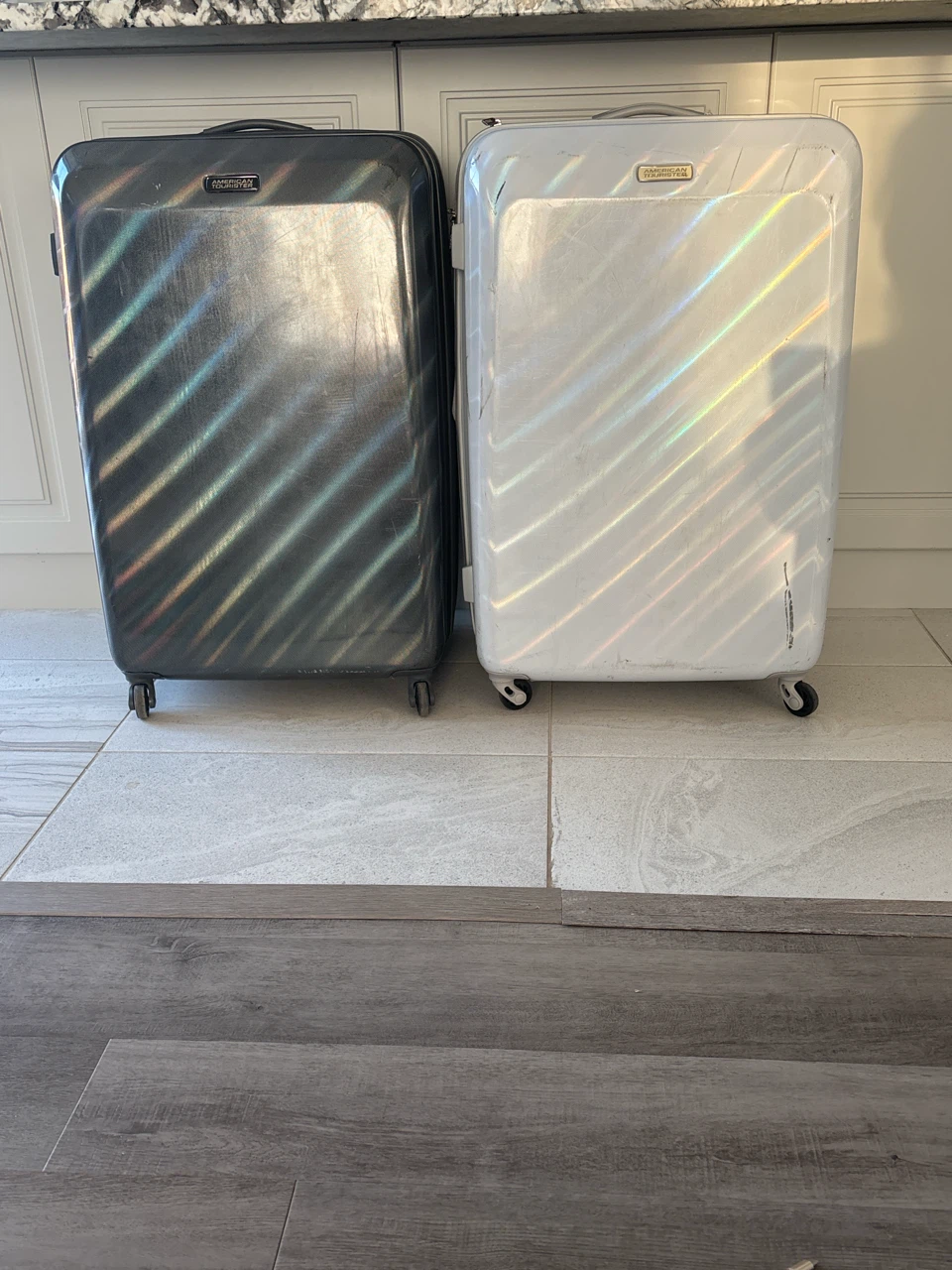 Two American Tourister Hard-Shell Suitcases