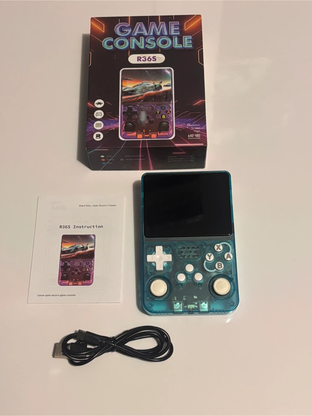 Transparent Blue R36S Handheld Game Console