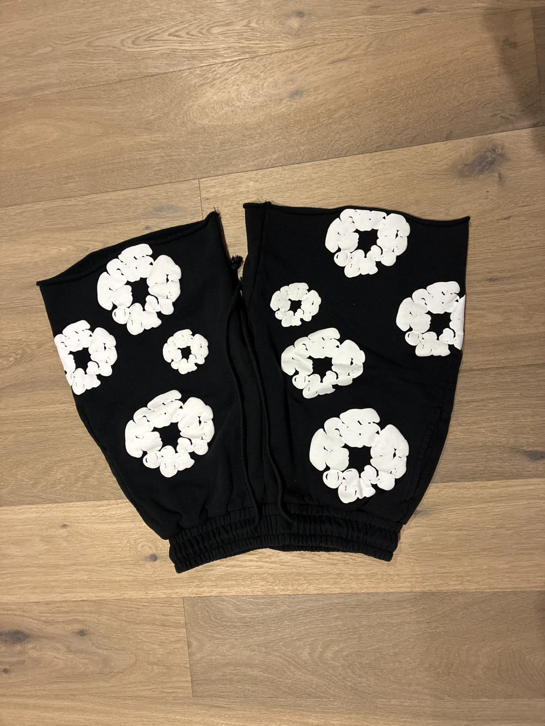 Black shorts with white floral pattern