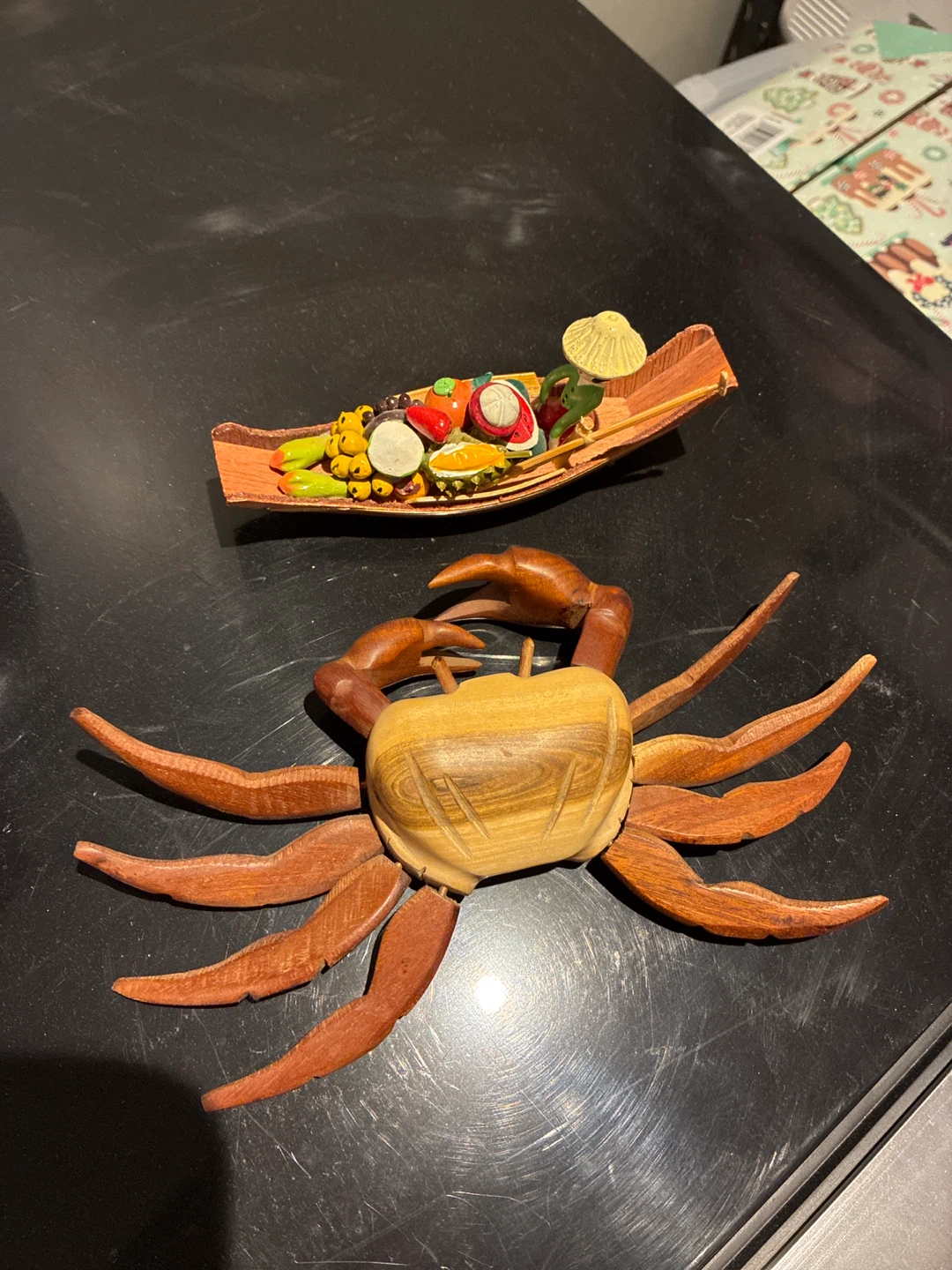 Wooden crab sculpture and decorative boat
