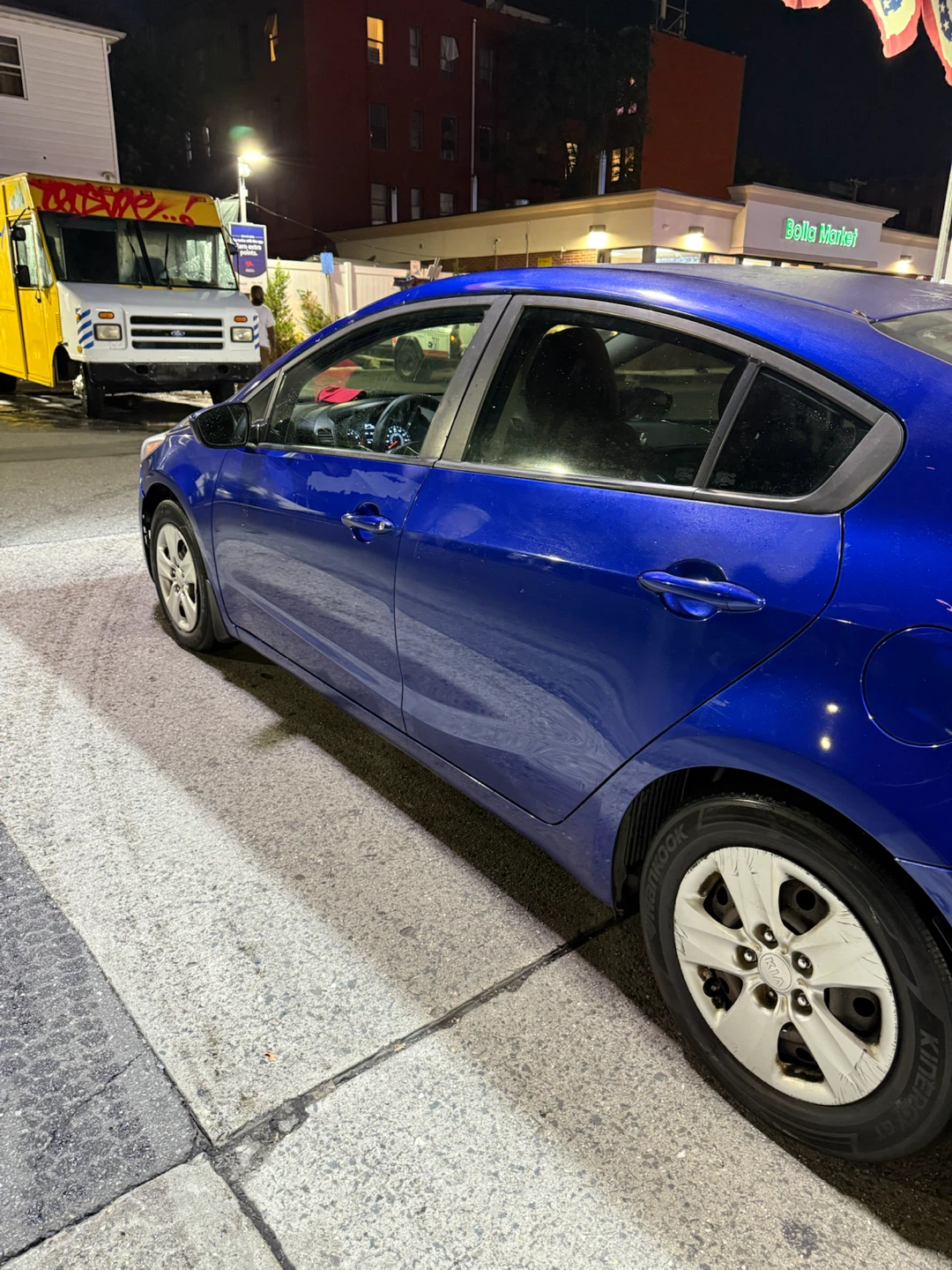 Blue Kia Sedan