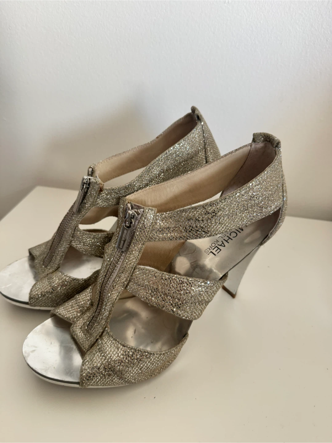 Michael Kors gold glitter zip-up heels