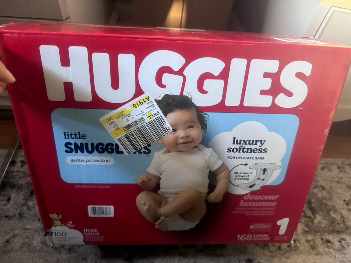 Box of Huggies diapers - photo 2