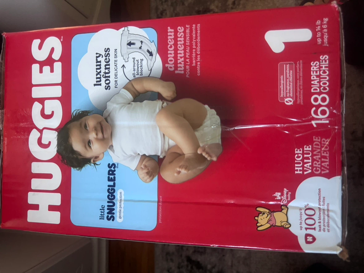 Box of Huggies diapers - photo 3