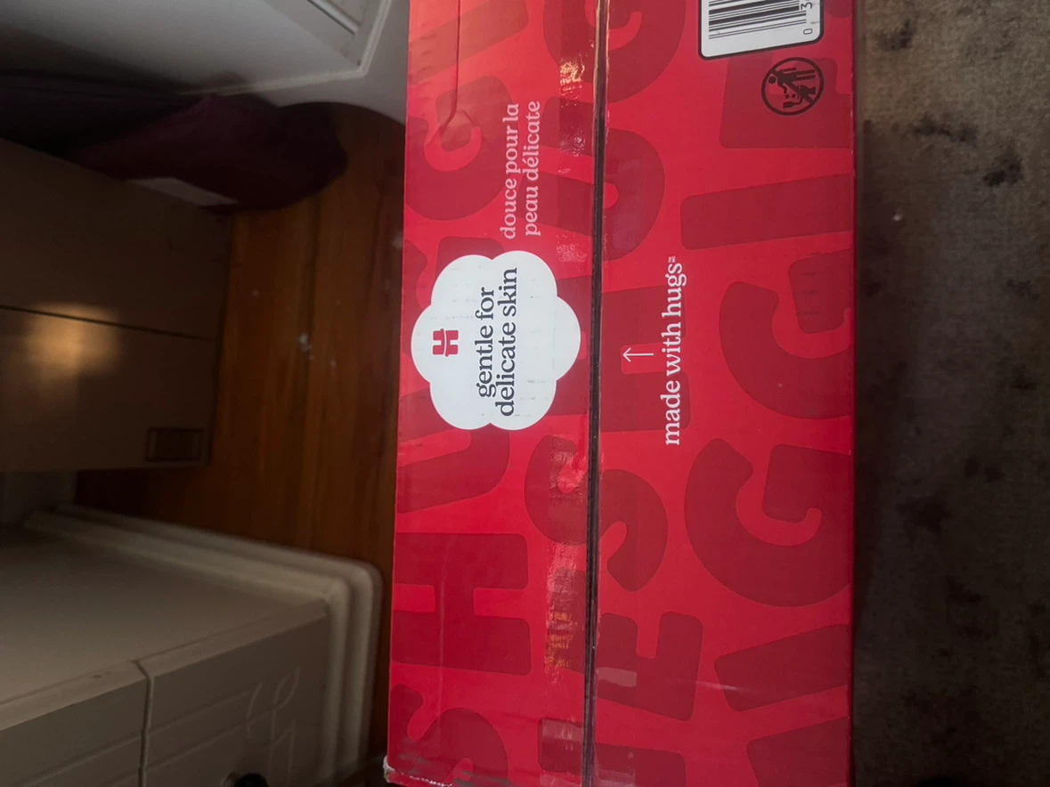 Box of Huggies diapers - photo 4
