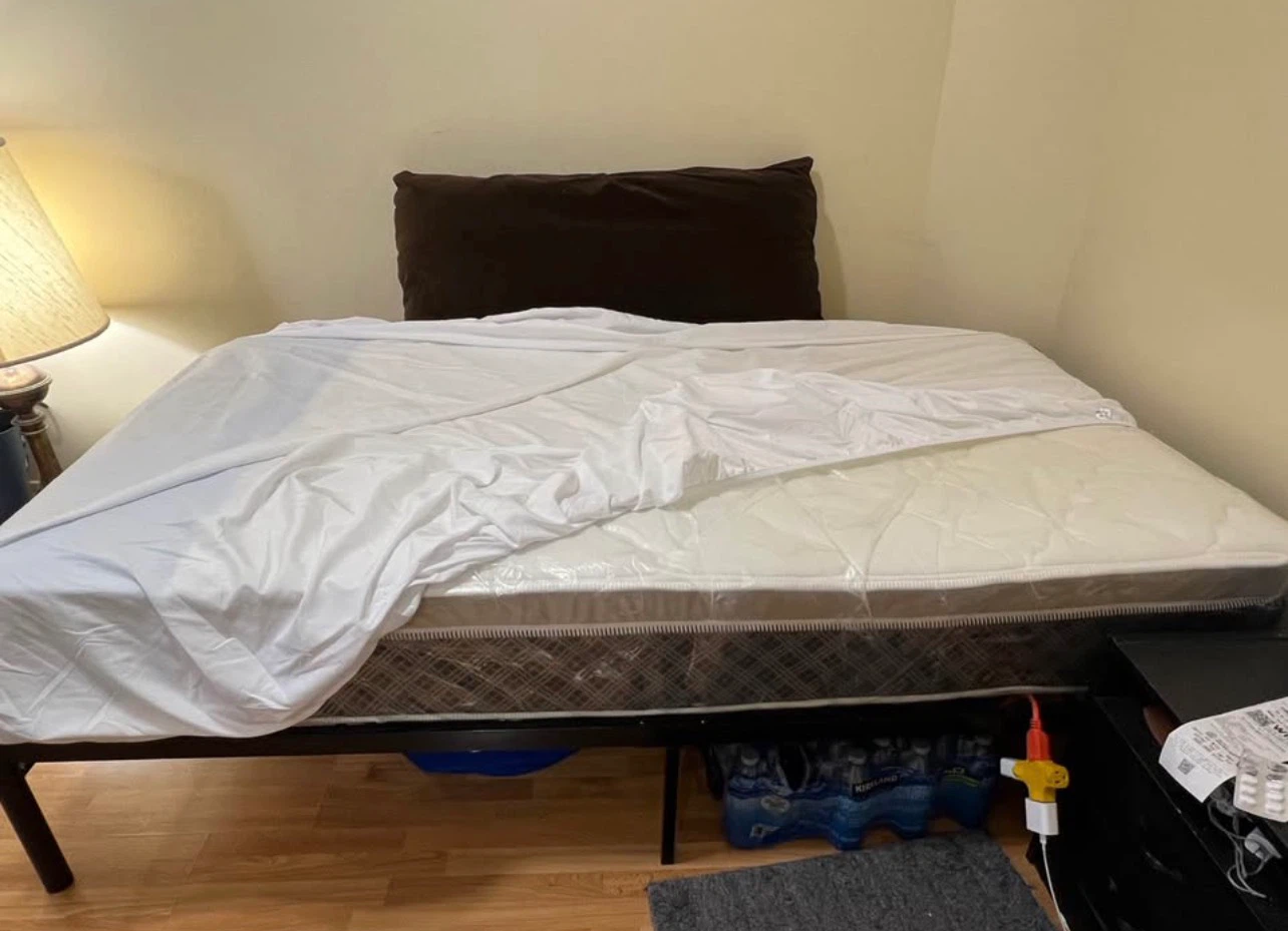 Single mattress and black metal frame