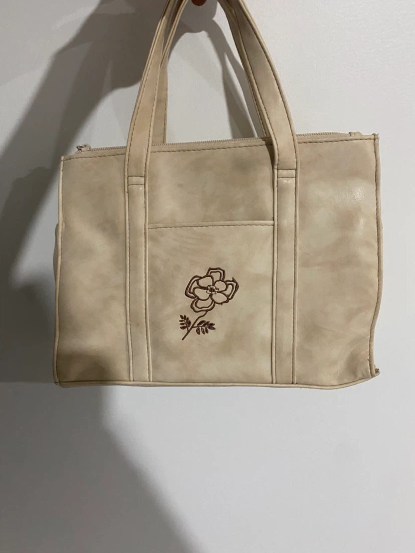 THE STONE cream floral handbag