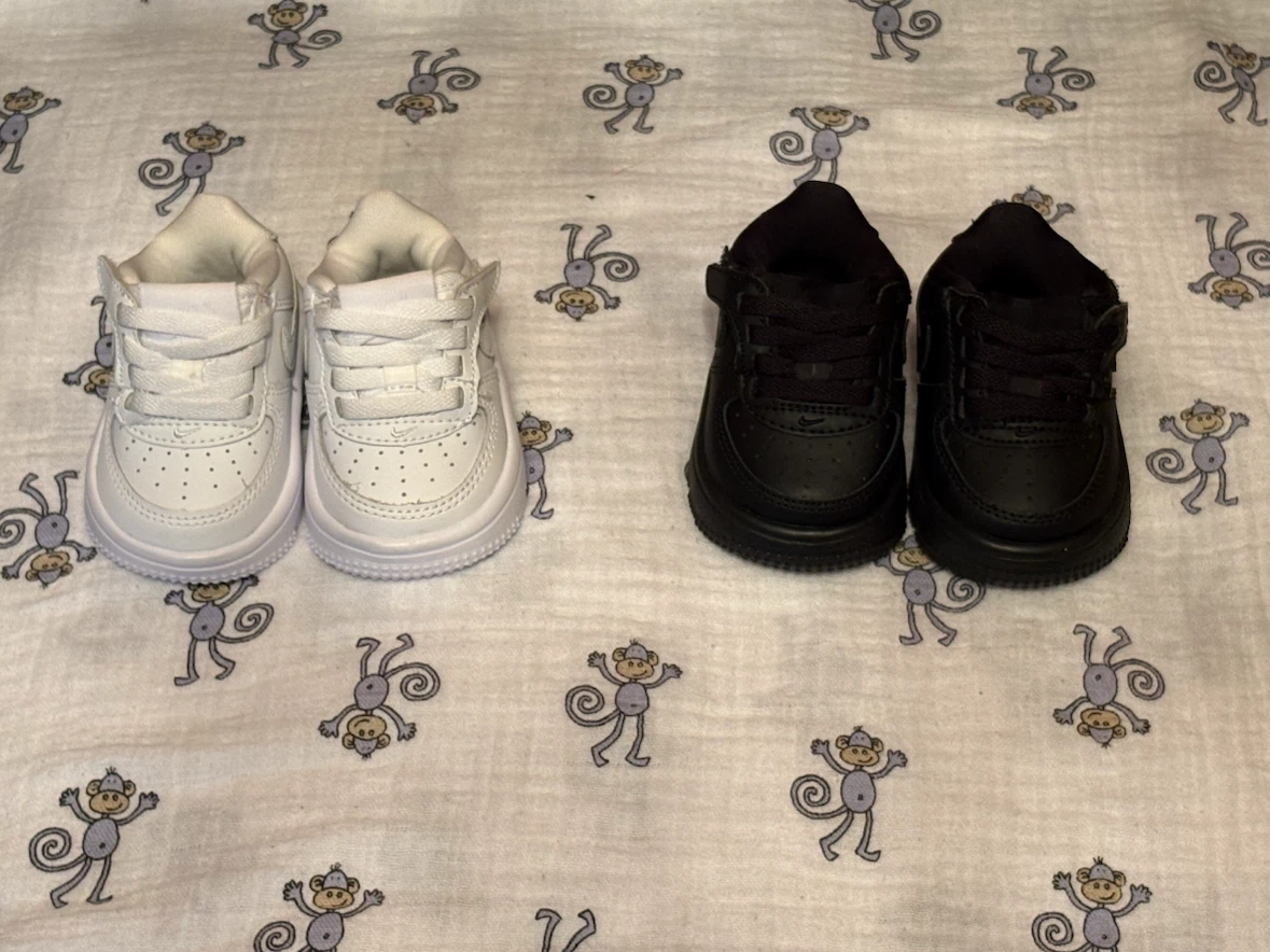 Two pairs of Nike Air Force 1 baby shoes
