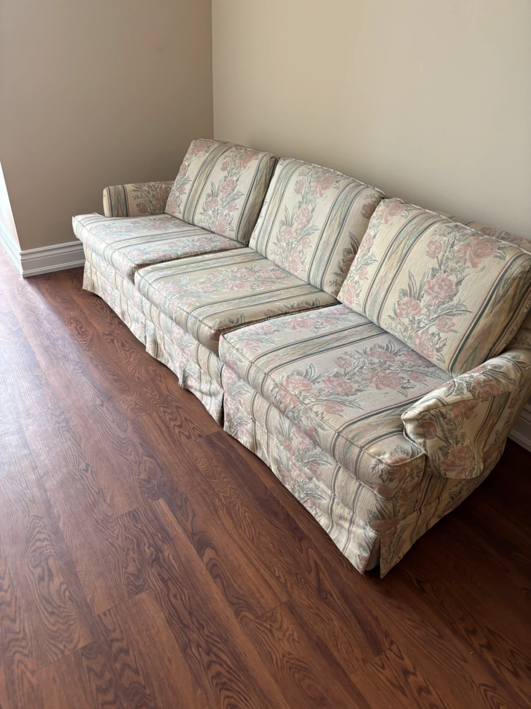 Floral pattern sofa and matching armchair