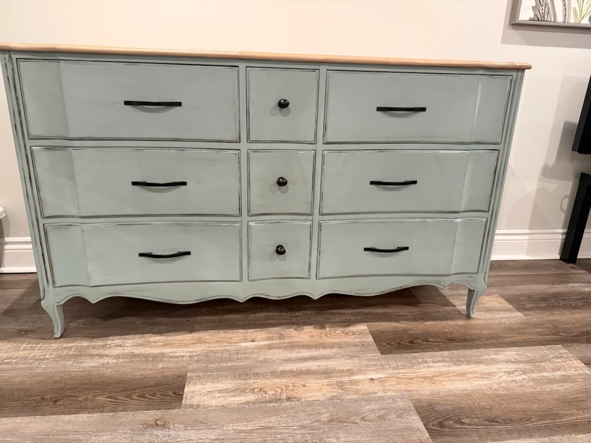 Refinished wooden dresser with nine drawers