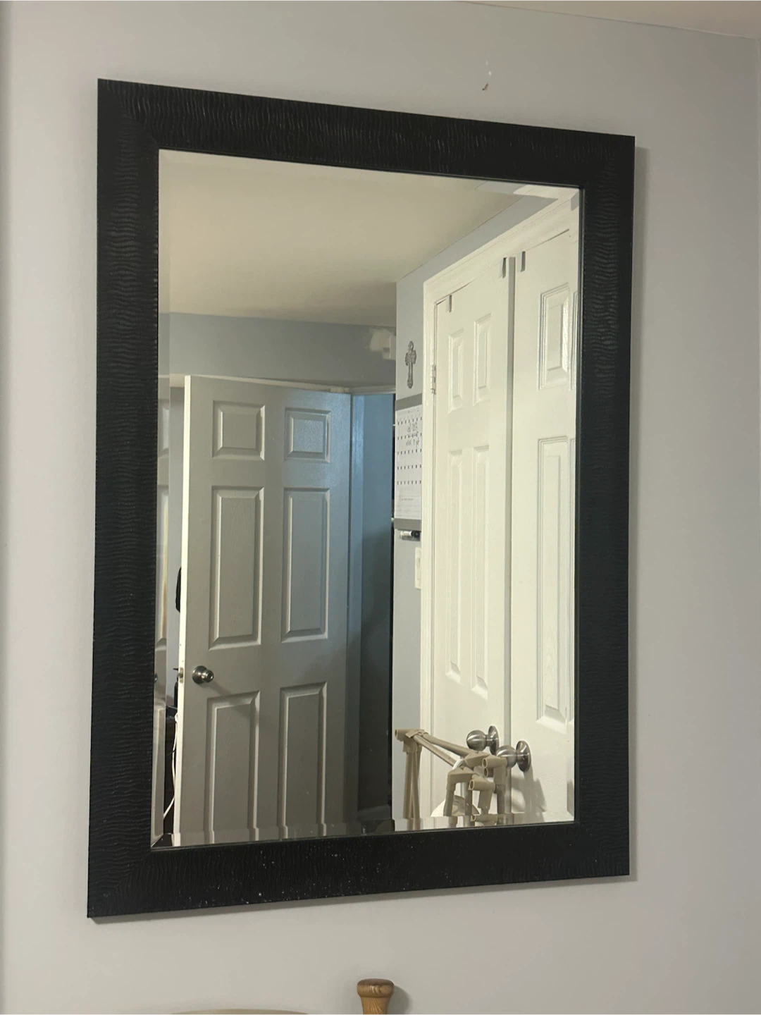 Large black wall mirror with textured frame