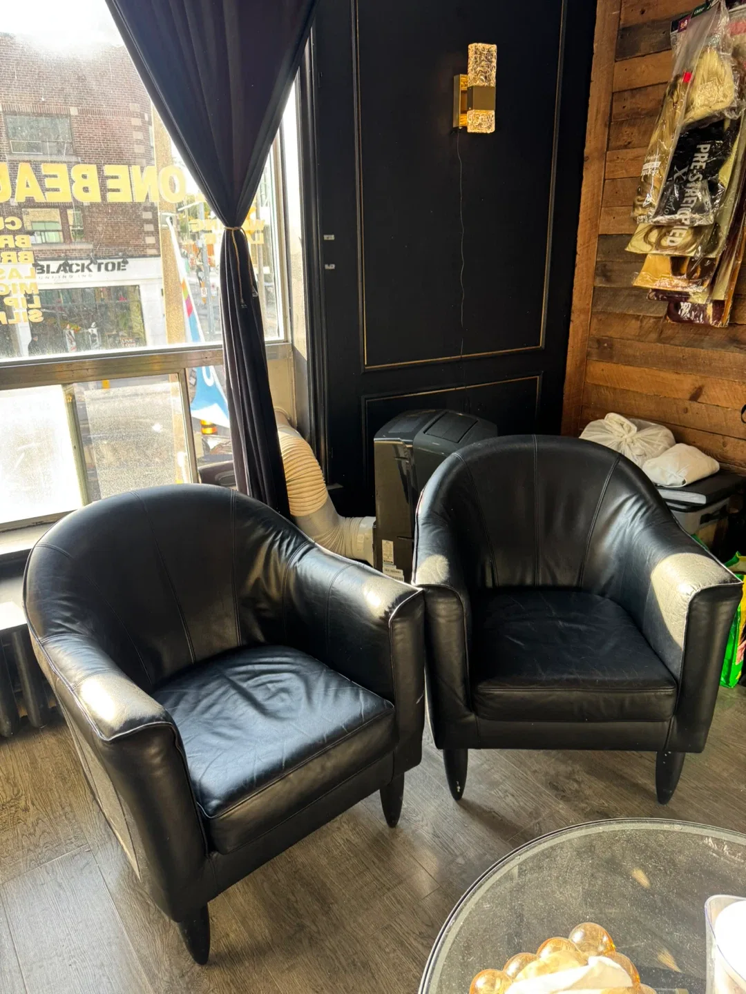 Pair of black leather chairs