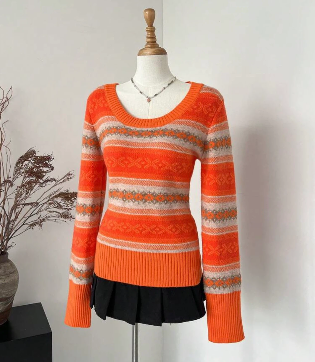 orange patterned sweater
