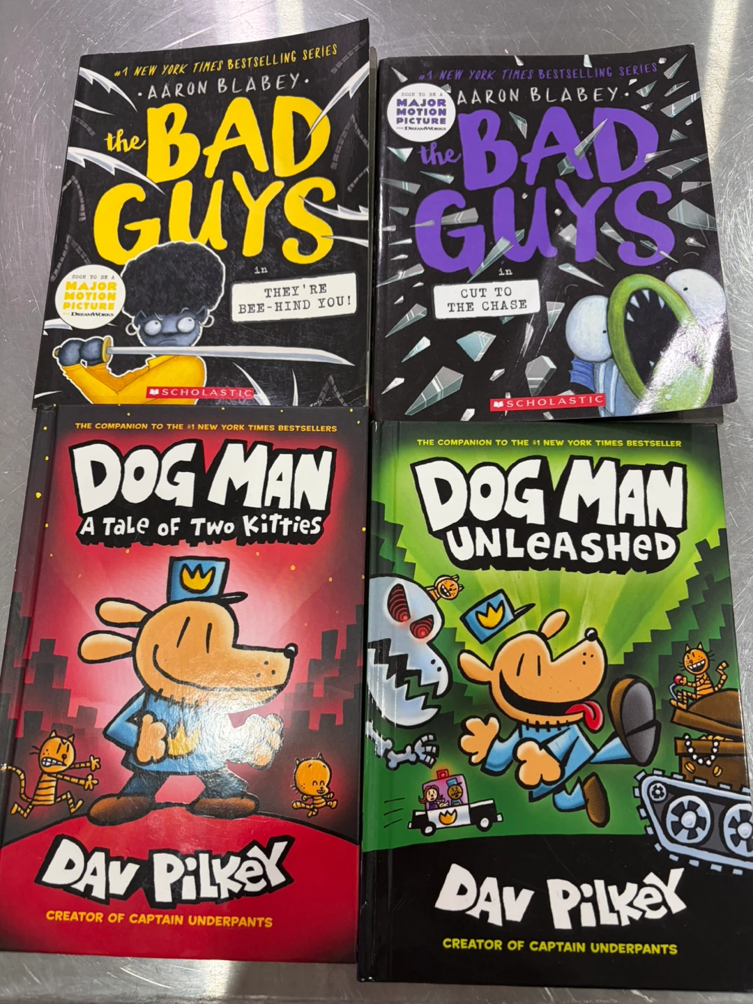 Set of 4 Graphic Novels: The Bad Guys and Dog Man