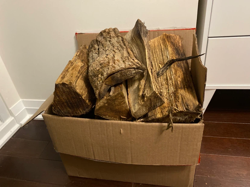 Cardboard box of assorted firewood