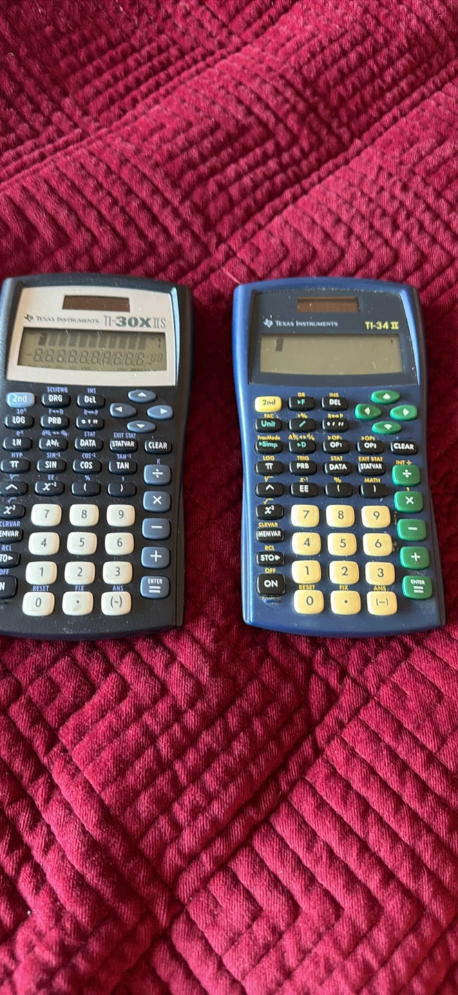 Two Texas Instruments Scientific Calculators