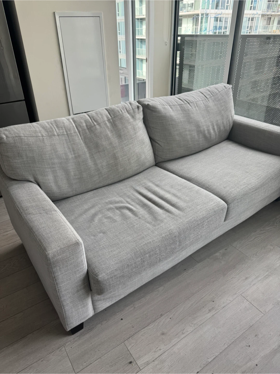 Light grey three-seater sofa