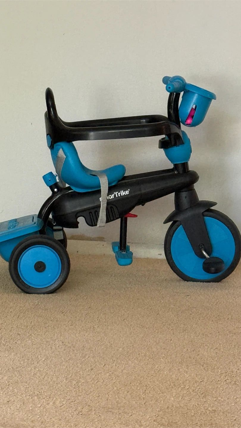 SmarTrike toddler tricycle in blue and black