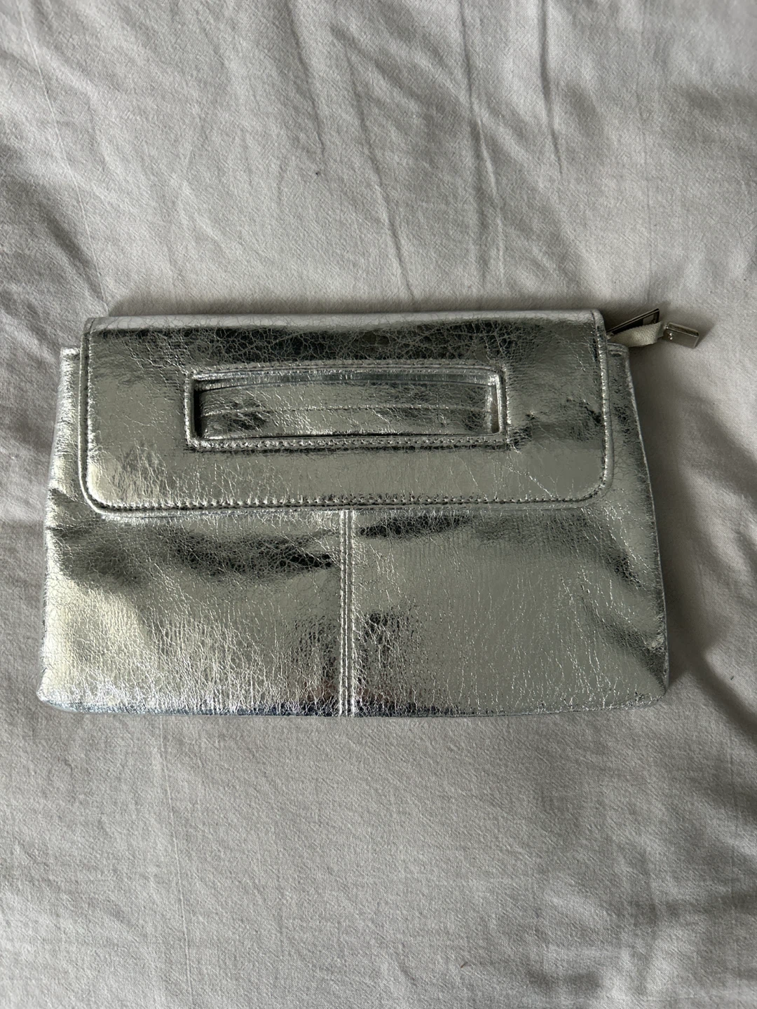 Silver metallic clutch bag