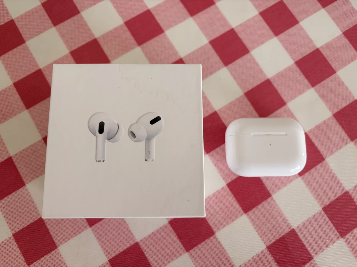Apple AirPods Pro (Gen 1) with charging case and box