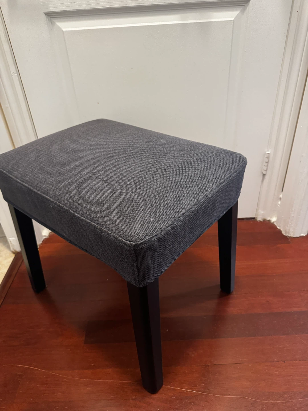 Dark grey fabric ottoman stool