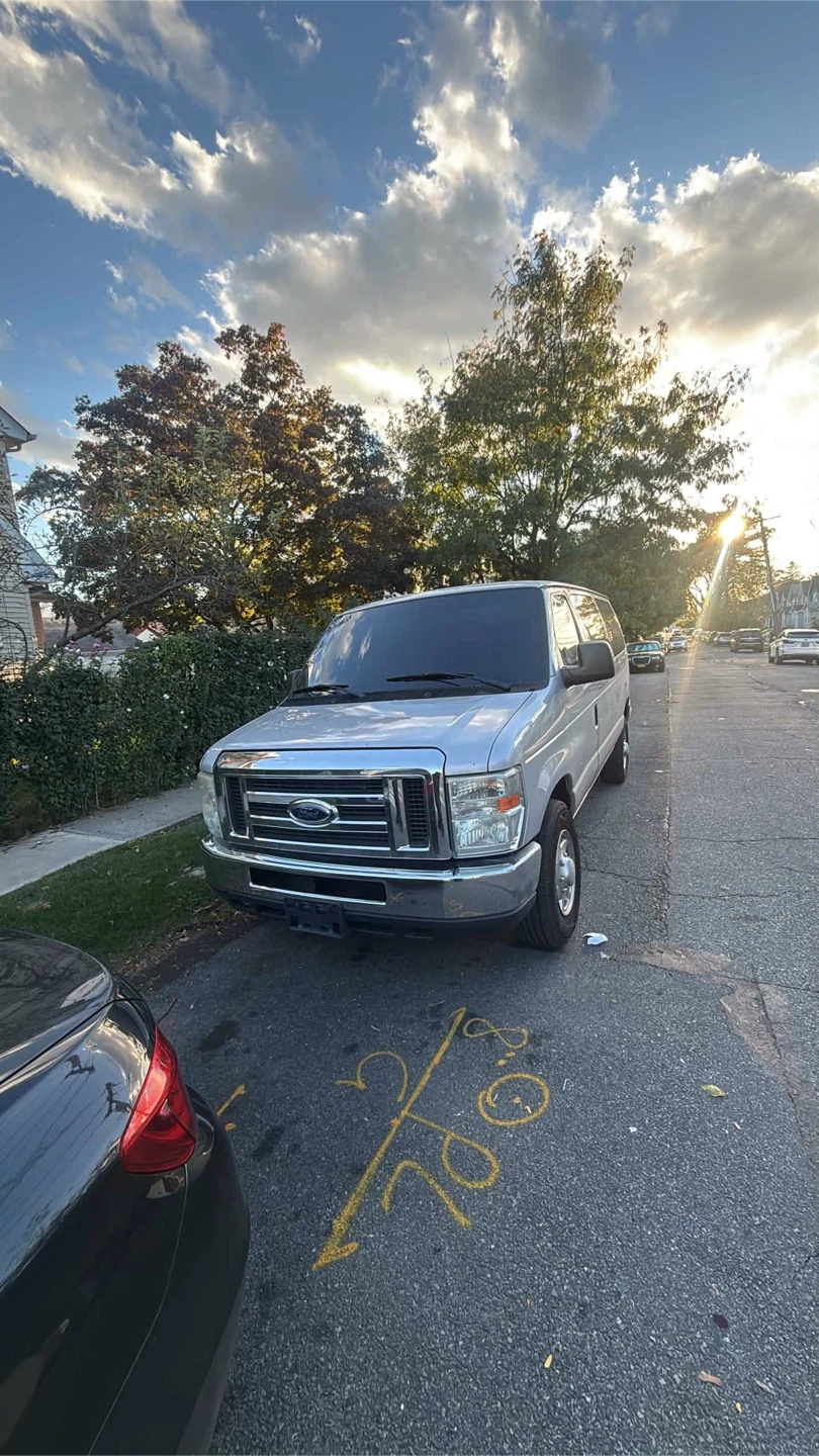 Silver Ford E-Series Passenger Van