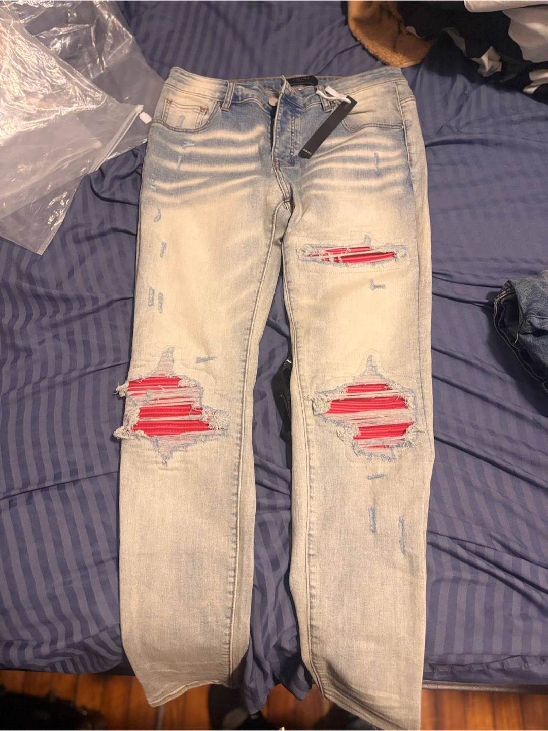 Amiri Distressed Jeans with Red Patch