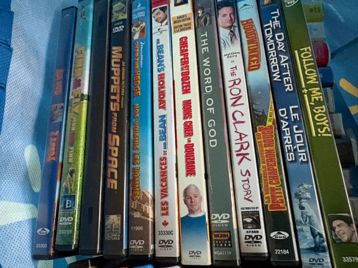Large collection of assorted DVDs and VHS tapes - photo 2