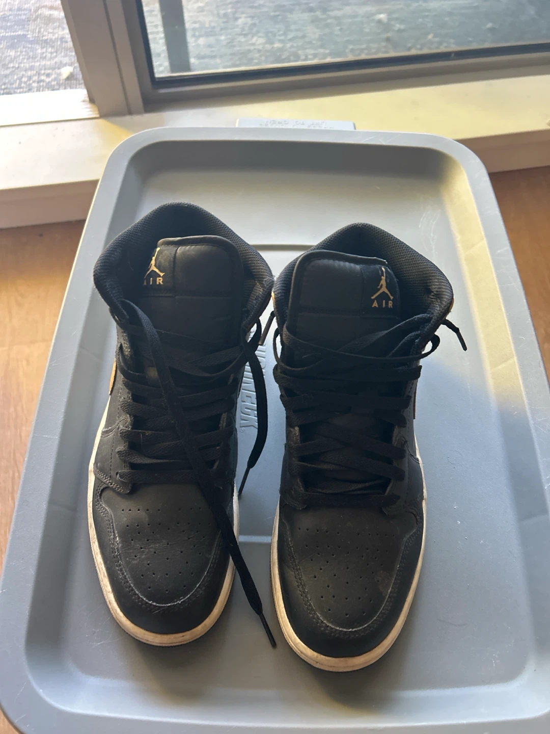 Jordan 1 Mid Black and Gold Sneakers