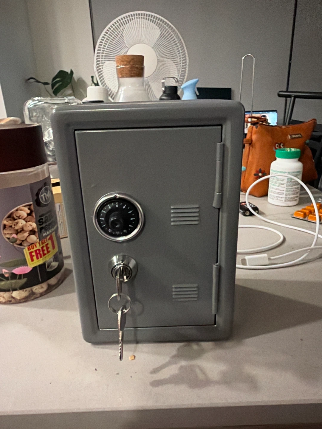 Small grey metal combination lock safe