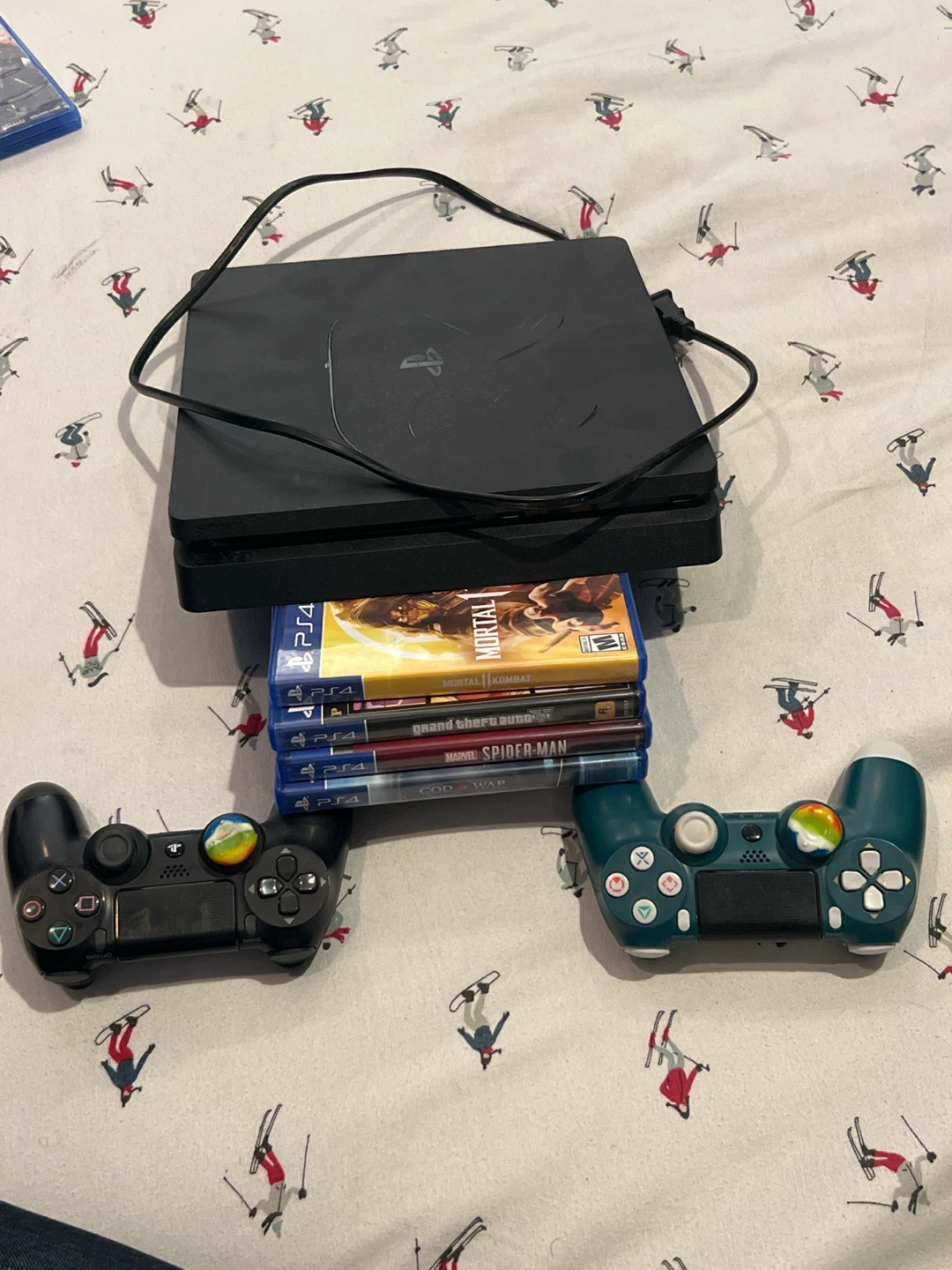 Sony PlayStation 4 Console, 2 Controllers, & 4 Hit Games
