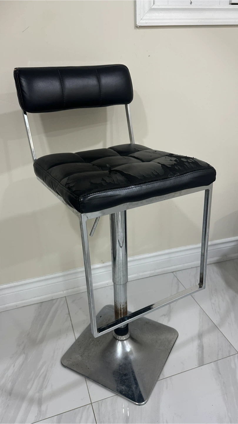 Adjustable black faux leather bar stool
