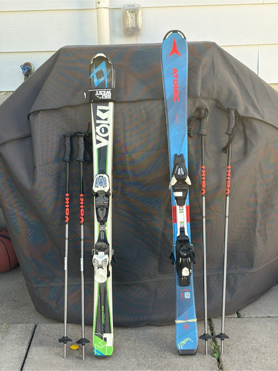 Volkl and Atomic Kids Skis with Poles