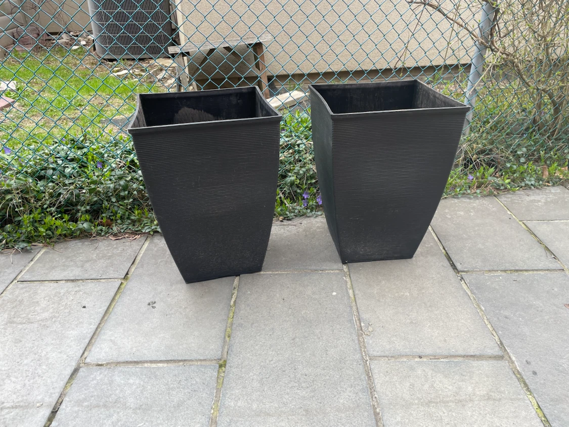 Two large black square planters