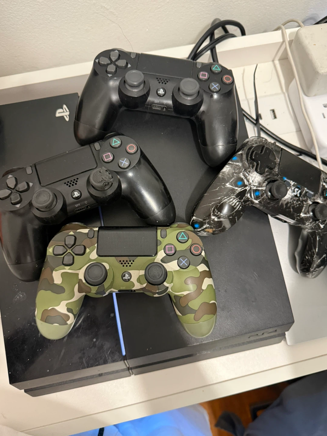 PlayStation 4 Console and 4 Controllers
