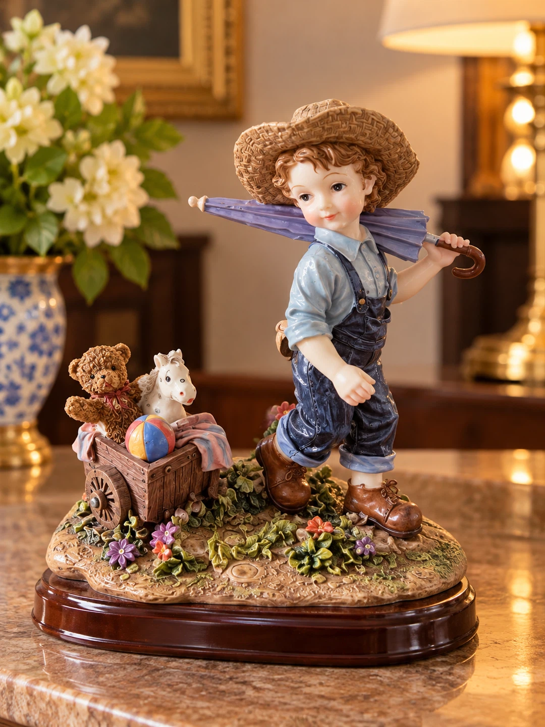 Decorative Porcelain Figurine of a Boy with Toy Wagon
