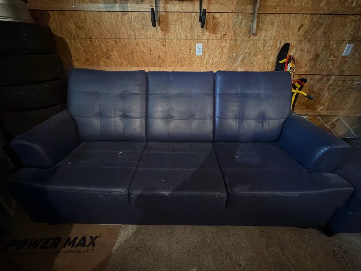 Blue faux leather sofa with ottoman