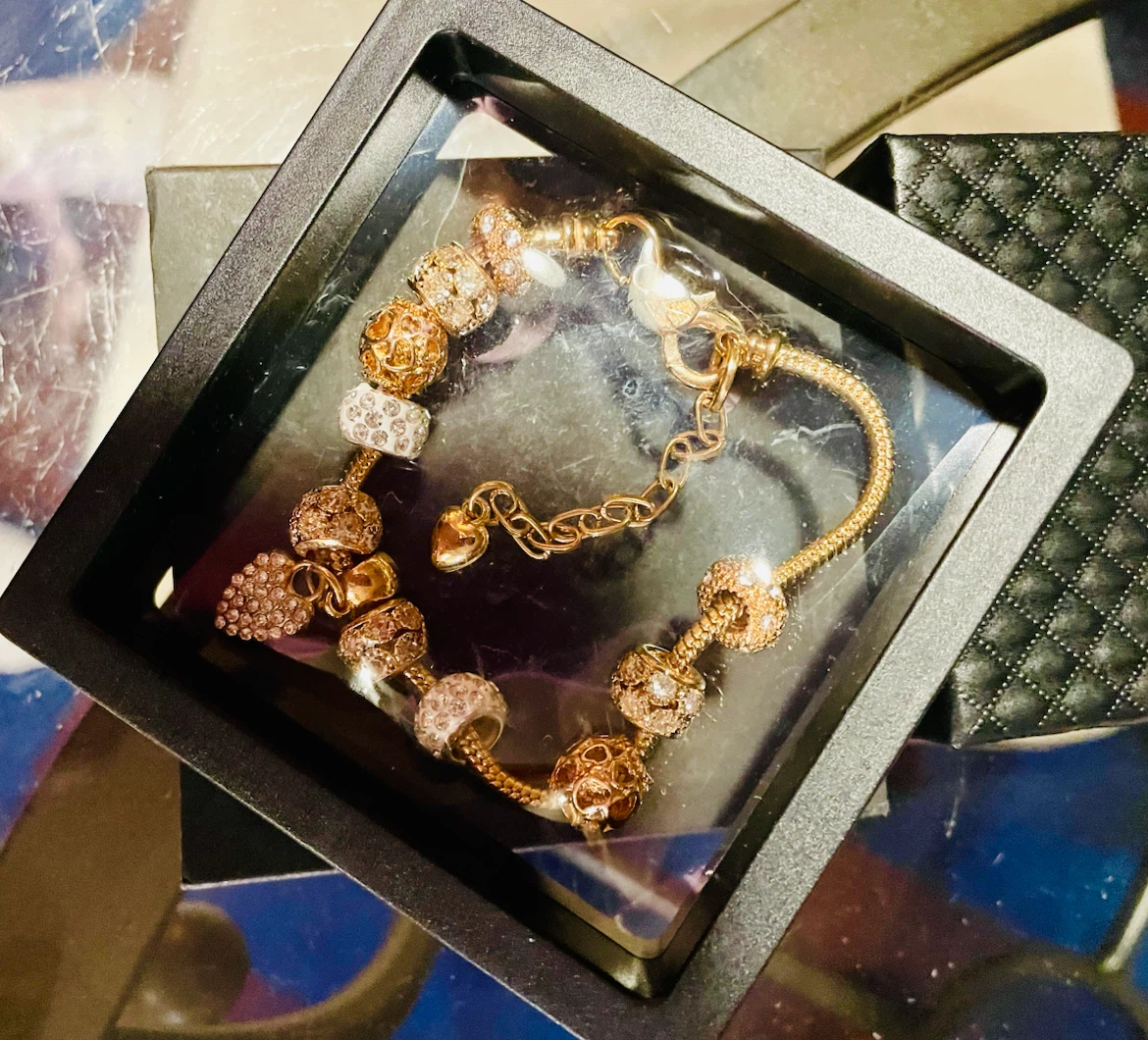 Gold-tone charm bracelet with rhinestones