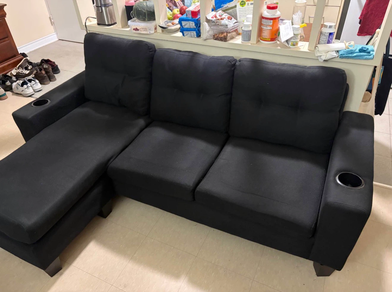 Black sectional sofa with cup holders