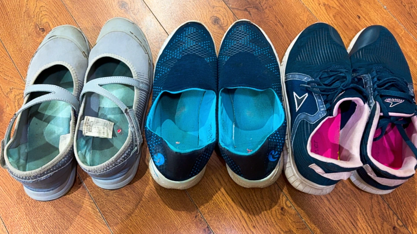 Three pairs of assorted athletic and casual shoes